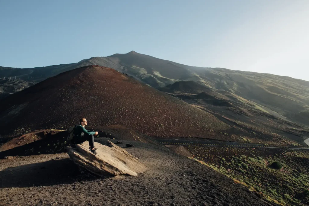 Pictured is a boy on Mount Etna